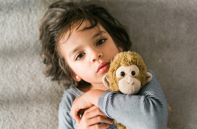 young boy and stuffed animal