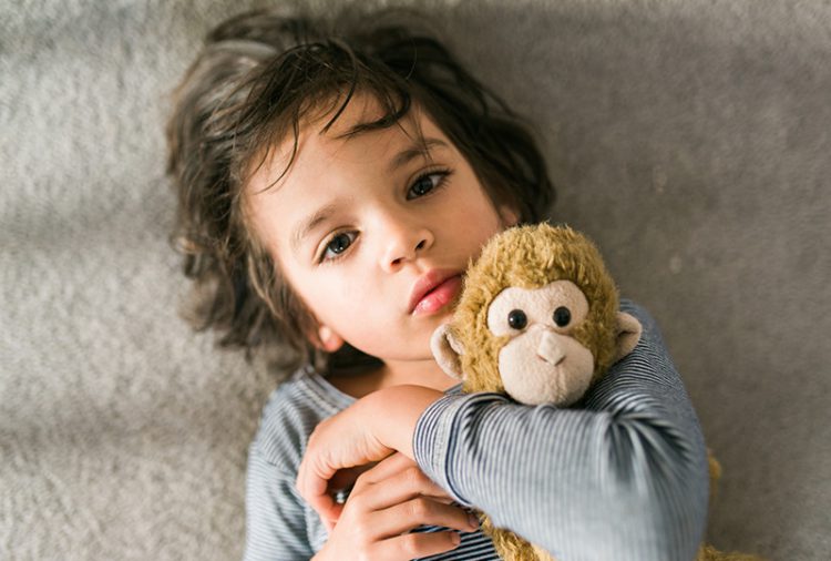 young boy and stuffed animal